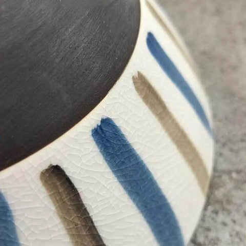 Close-up of the DWEIHDV Ceramic Wall Sconce Vintage Gold Wall Light Fixture showing hand-painted striped ceramic shade.