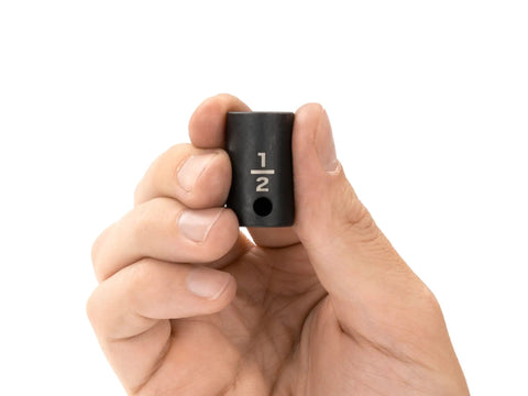 Hand holding Three Eighths Inch Drive To One Half Inch Shallow Twelve Point Impact Socket Built Tough With Laser Markings