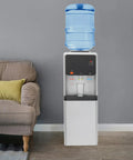 Triple Temperature Water Dispenser With Hot Cold And Room Temperature Faucets, 5.02 Gallon Freestanding Electric Cooler And Heater in a living room