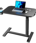 32 Inch On Wheels Overbed Desk With Cup Holder And Height Adjustable Pneumatic Lift Rolling Computer Cart For Home Office Ergonomic Laptop Standing Desk Bedside Table With Flexible Height Black For Your Home Office Hustle showing a black desk with laptop and cup holder.