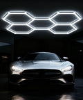 LED Hexagon Garage Light 156W 18720LM 6500K Daylight White Ceiling Lamp illuminating car in garage