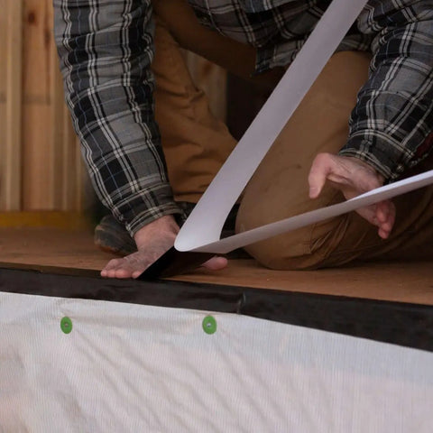 Person installing Pro Grade Flashing Tape For Windows And Doors, 3.75 Inch Wide, 30 Foot Roll, black, all weather, no primer needed