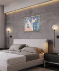 Industrial Gold And Black 1 Light Wall Sconce With Long Arm And Globe Glass Shade Delivers A Lit Glow Modern Wall Mounted Lamp For Bedroom Hallway Clear Glass Set Of 2 installed above bed against concrete wall