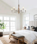6-Light French Country Farmhouse Chandelier for dining room and living room, rustic brown distressed wood in a cozy bedroom setting