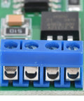 Close-up of a Three Point Three Volt To Twenty Four Volt SCR Module With Optocoupler Isolation High Power Signal Converter terminal block