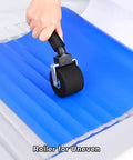 Two Inch Foam Seam Roller For Vinyl Wrap On Uneven Textured Surfaces And Car Wrapping Rivet Roller Tool in use on blue vinyl