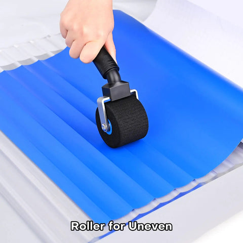 Two Inch Foam Seam Roller For Vinyl Wrap On Uneven Textured Surfaces And Car Wrapping Rivet Roller Tool in use on blue vinyl