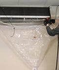 Technician using Mini Split Bib Kit for cleanups that catch water and coil cleaner with no mess protect walls and floors from over spray