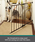 Bulletproof Hardware Mounted Walk Thru Pet Gate 31 Inches Tall Fits 28 To 48 Inch Doorways with a dog by the stairs.