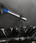 Heavy Duty Portable Magnetic Drill Press With 1100 Watt Motor And Variable Speed Control For Annular Cutting discharging metal shavings into a bin.
