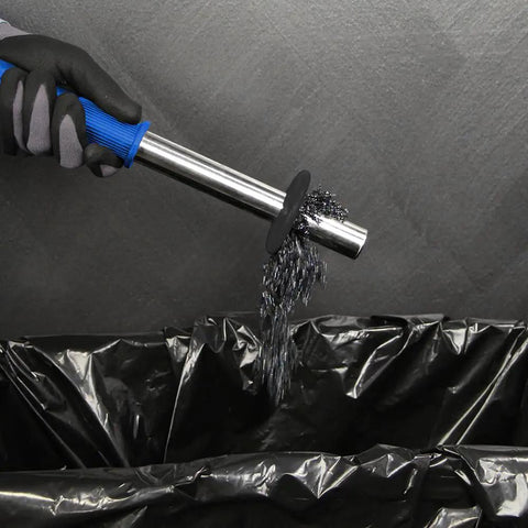 Heavy Duty Portable Magnetic Drill Press With 1100 Watt Motor And Variable Speed Control For Annular Cutting discharging metal shavings into a bin.