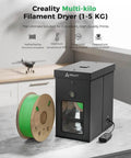 Large Kilo Filament Drying Storage Box With Detachable Heating Module For 1Kg To 5Kg Spools beside green spool on table