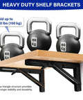 Slick Two Pack 16 Inch Black Folding Shelf Brackets Rock Solid Space Saving Wall Mount showing heavy weight support with kettlebells.