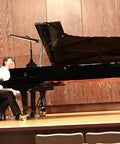 Grand piano with musicians, illuminated by Wide 21.26 Inch Piano Lamp With LED Light Panel, Eye-Caring, Stepless Dimming, in concert setting.