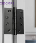 Top Shelf 4 Inch Matte Black Heavy Duty Stainless Steel Door Hinges With Non Removable Pin For Rock Solid Outswing Security And Smooth Whisper Quiet Operation 2 Pack, close-up view with screws.