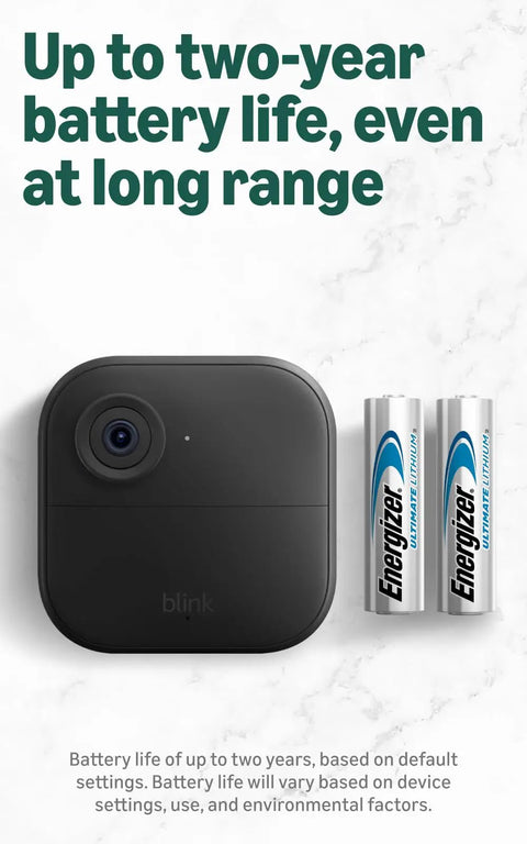 Extended Range Wireless Outdoor Security Camera System With Four Cameras beside batteries showcasing 2-year life