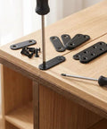 Heavy Duty Stainless Steel Straight Bracket Kit With 30 Brackets And 72 Screws for wood repair on a wooden surface.
