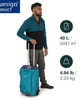 Man using 40L collapsible wheeled carry on duffel with backpack straps, lightweight travel solution, bluesign product, teal and blue design.