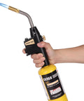 Person holding soldering and brazing torch for MAP Pro propane or propylene fuel with turbine boost flame adjustable flame lock button