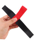 Scuba Tank Strap Holder With Quick Release For Easy Attachment And Transport, red dive gear accessory in hand showing durable rubber construction