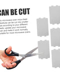Person cutting 10 Piece Mica Insulation Sheets For Microwave Ovens, Heat Resistant Waveguide Covers, Oil Resistant Mica Plates