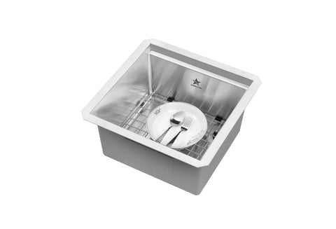 Top view of Workstation Ledge Undermount Single Bowl 304 Stainless Steel Kitchen Sink with grid and dishes, 15x15 inches modern design.