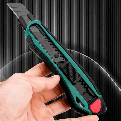 Tough As Nails Heavy Duty Tin Snips And Industrial Scissors With Serrated Stainless Blade Ergonomic Handles For Sheet Metal Cable Notch Leather Fabric Cutting Seven Eight Inch Straight Edges utility knife in hand, showing safety features.