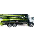 Side view of Road Ready Concrete Boom Pump And Mobile Mixer Truck Rig with extended boom, constructed for heavy-duty residential use.