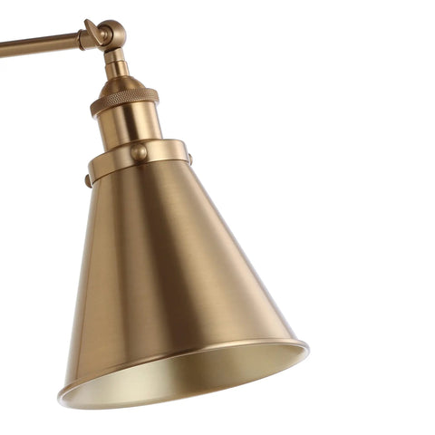 Close-up of Gold Brass Industrial Swing Arm LED Wall Sconce with adjustable metal shade for bedroom and reading nook.