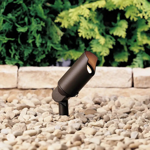 Accent 1-Light 12V MR11 Spotlight in Textured Architectural Bronze, Wet Location Rated With Heat-Resistant Clear Flat Glass on stones