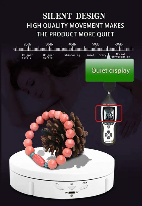 JAYEGT 22lbs Motorized Rotating Turntable Display Stand showcasing jewelry and pinecone, demonstrating quiet performance with sound measurement.