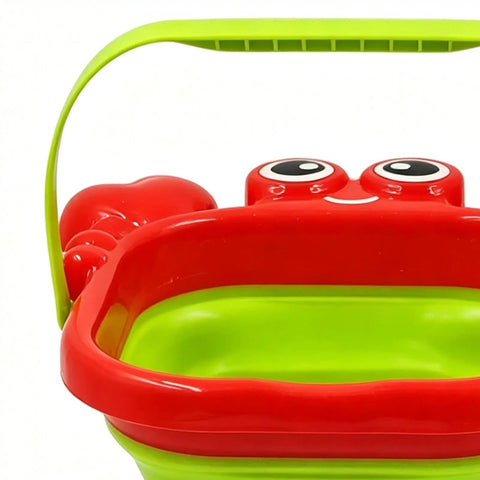 Close-up of red and green foldable bucket from Foldable Bucket And Shovel Tools Kit For Kids Sand Toys With Animal Design Five Piece Travel Beach Set
