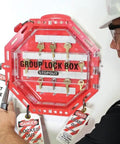 Red Plastic Group Lockout Box With Clear Front 13x13x3.5 Inches for 44 Padlocks in use by worker with safety tags visible