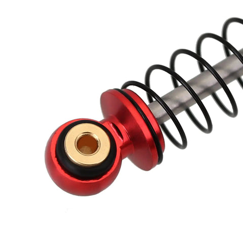 Close-up of red and black 39mm Aluminum Threaded Adjustable Oil Filled Shocks For SCX24 RC Crawlers, gold eyelet detail.