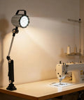 Heavy Duty Long Arm Machine Work Light, 18W LED With Multi-Joint Adjustable Design illuminating a sewing machine at a workbench.