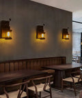 Dining room with Set Of Two Rustic Industrial Wall Sconces in Black Metal with Wood Backplate, cozy country vibe lighting