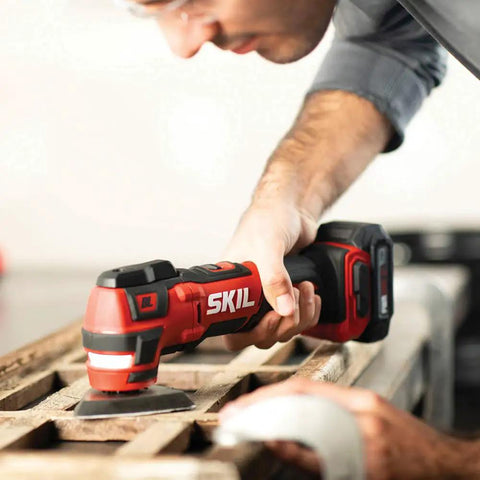 Using brushless 12V oscillating multitool from Four Tool Power Pack With Brushless 12V Half Inch Drill Driver, Oscillating Multitool, Area Light, And Bluetooth Speaker For Real DIY Pros. Includes Two 2.0Ah PWR Core 12 Batteries And Standard Charger For Long Lasting Runtime on wood surface.