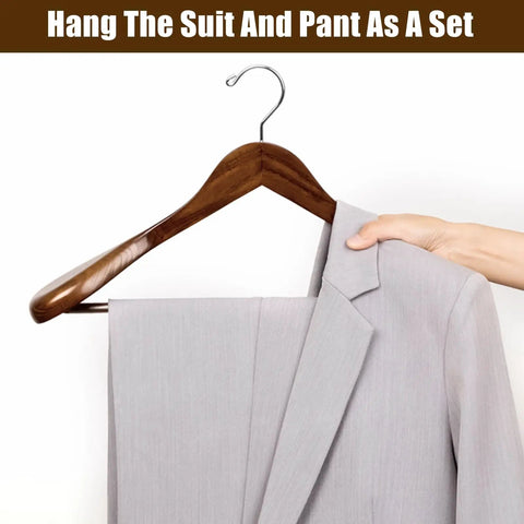 Solid Walnut Wood Coat Hangers Six Pack With Extra Wide Shoulders And Non Slip Pants Bar holding a suit jacket and pants.
