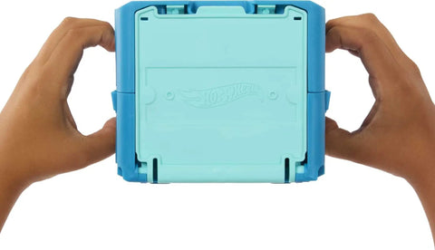 Hands holding stackable storage box from Track Builder Ice Crash Playset With One Sixty Four Scale Vehicle And Ten Component Parts