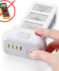 Phantom 3 Replacement Intelligent Flight Battery 4480mAh 15.2V 68Wh with LED indicators being pressed.