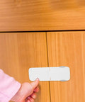 2 Pack Childproof Drawer Locks For Cabinets And Drawers Universal Fit ABS Self Adhesive Safety Latches in use on wooden cabinet