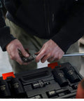 Mechanic using Heavy Duty 48 Piece Impact Socket Set With 6 Point Deep And Shallow Sockets SAE And Metric From 5/16 To 3/4 Inch And 8 To 22 mm CR-V Steel Mechanic Kit For Pros And DIYers.