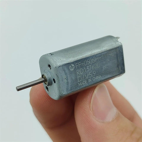 Mini 050 DC Motor 15mm Micro Electric Motor With Precious Metal Brush Runs On 3V 5V 6V Or 9V held between fingers