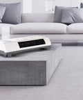 Dope 2000W Wall Mounted Air Conditioner And Heater With Touch Screen Remote Control on a concrete surface in a modern living space.