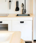 Kitchen setup with cabinets featuring 4 Pack Flush Pull Ring Handles 3 Inch Hidden Recessed Furniture Grips For Cabinets And Doors Aluminum Alloy Matte Black Sleek Low Profile Minimalist Hardware No Visible Screws