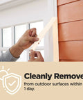 Person peeling Contractor Grade Tan Masking Tape 0.7 Inch By 60.1 Yards One Roll from exterior wall cleanly