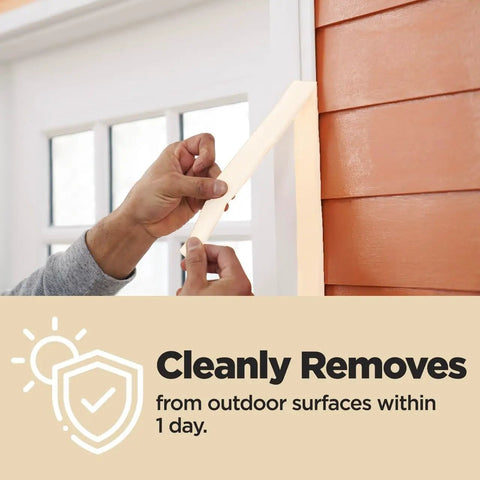 Person peeling Contractor Grade Tan Masking Tape 0.7 Inch By 60.1 Yards One Roll from exterior wall cleanly