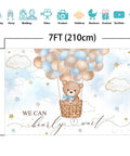 Blue Bear Hot Air Balloon Backdrop For Boy Tot Friendly Baby Shower Photo Booth Prop 7x5ft Cotton Fabric, Reusable, Wrinkle Resistant, Easy Iron And Wash, Cake Table Decor And Party Photo Station. Cartoon bear sits in a basket with balloons.