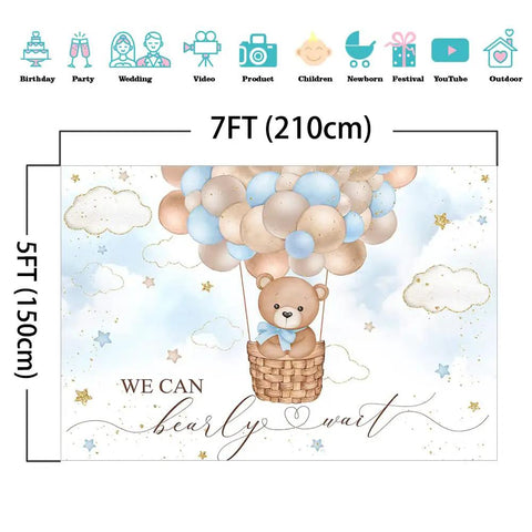 Blue Bear Hot Air Balloon Backdrop For Boy Tot Friendly Baby Shower Photo Booth Prop 7x5ft Cotton Fabric, Reusable, Wrinkle Resistant, Easy Iron And Wash, Cake Table Decor And Party Photo Station. Cartoon bear sits in a basket with balloons.
