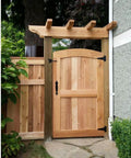 Wooden garden gate installed with Heavy Duty Gate Hardware Kit With Self Locking Gate Latch 6 Inch T Strap Hinges, rustic setting.